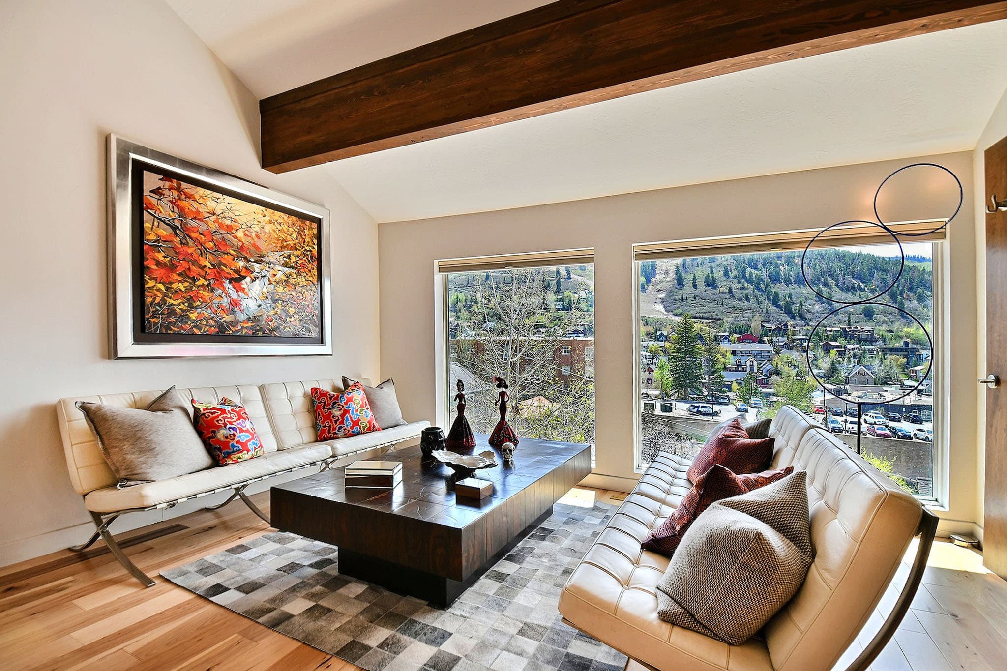 Seating Area with Table, Two Leather Sofas, and Painting