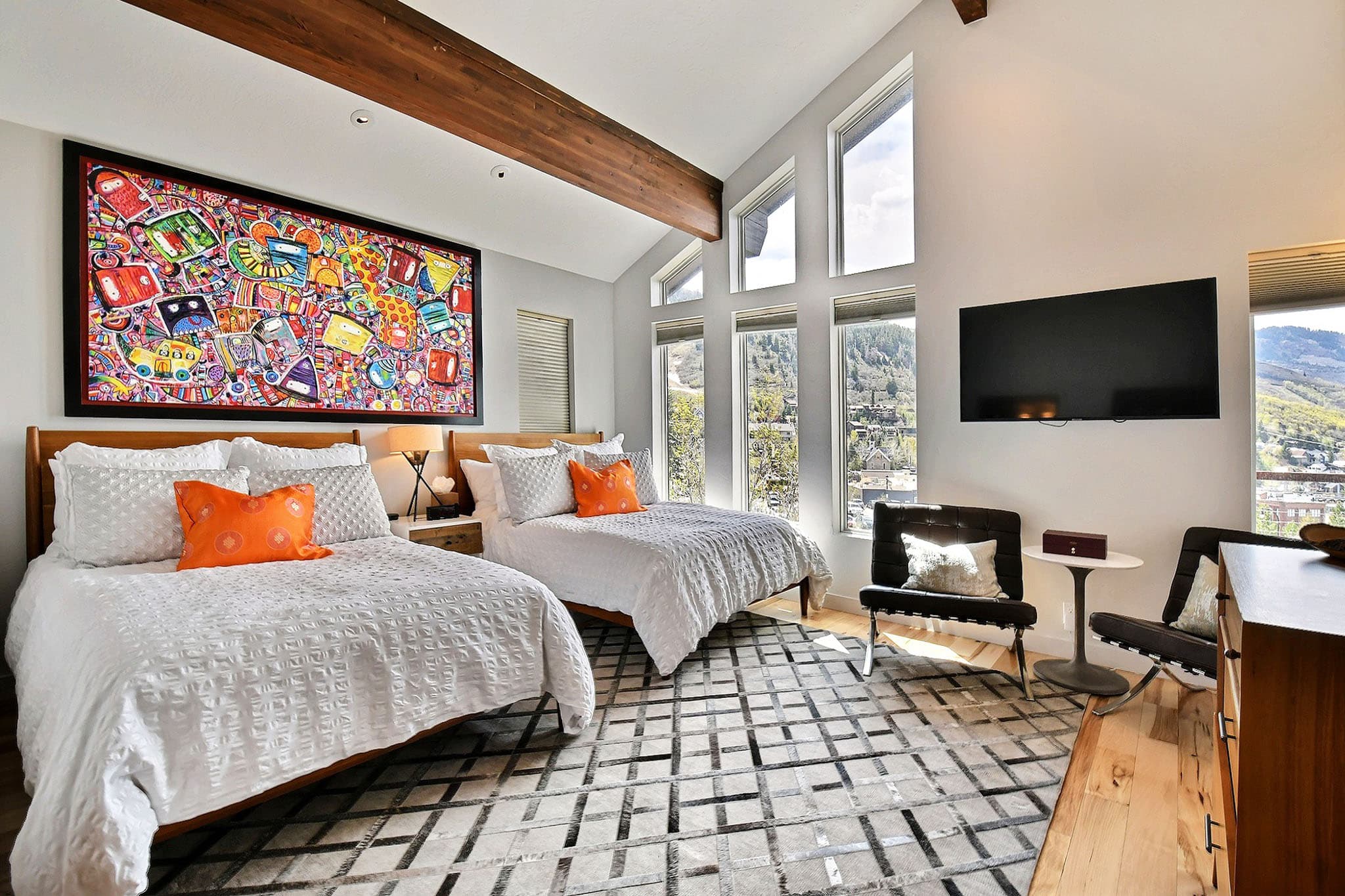 Two Beds for Two, Large Painting, Leather Chairs, and TV.