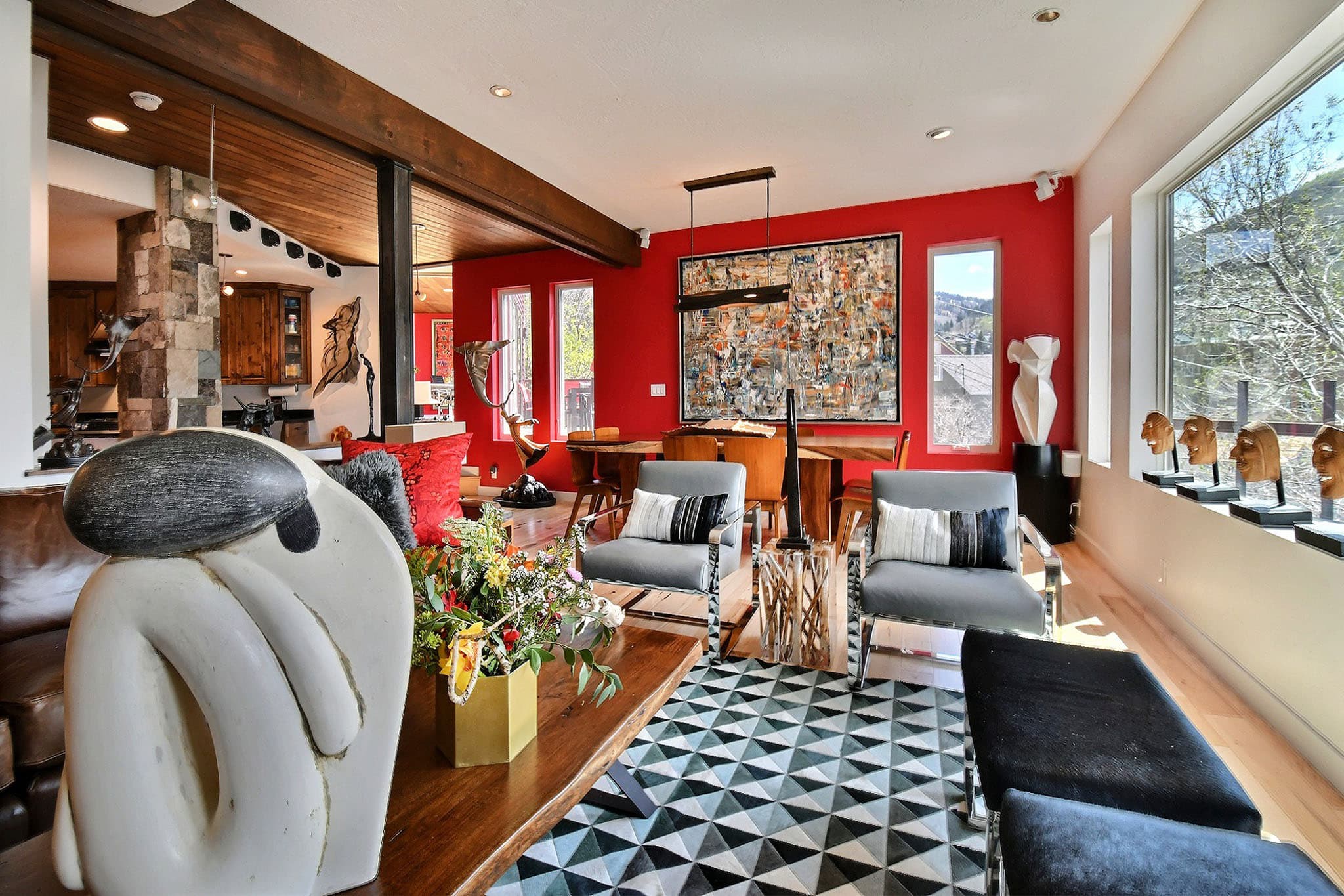 Two Chairs, Statue, and Flowers inside Luxury Park City Vacation Rental