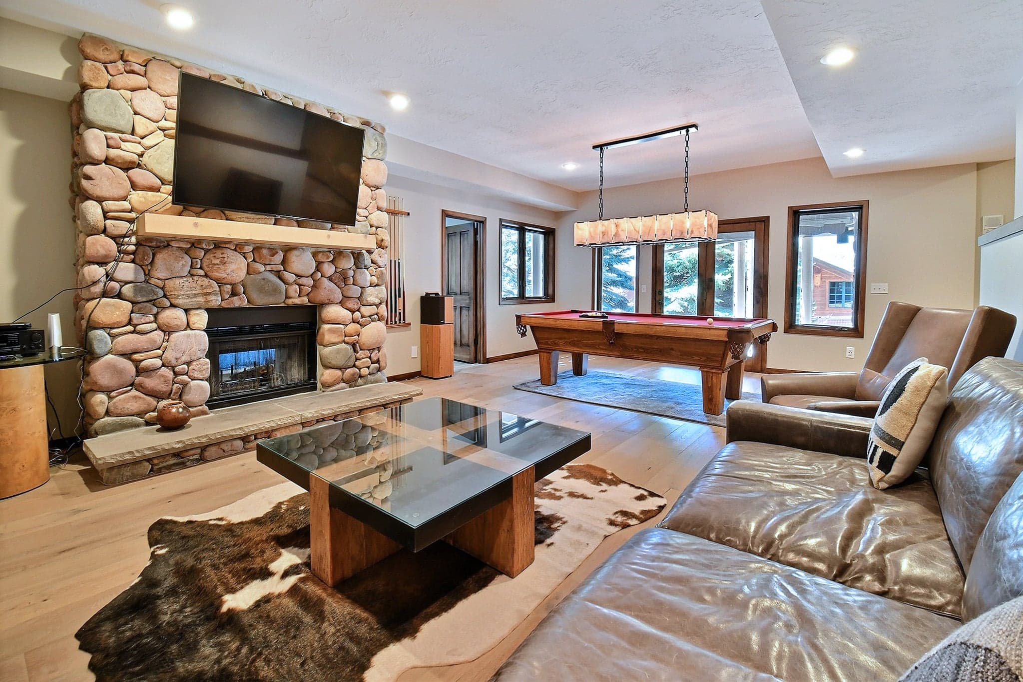 Secondary Living Space Featuring a Game Room, a Fireplace and a Flat Screen TV.