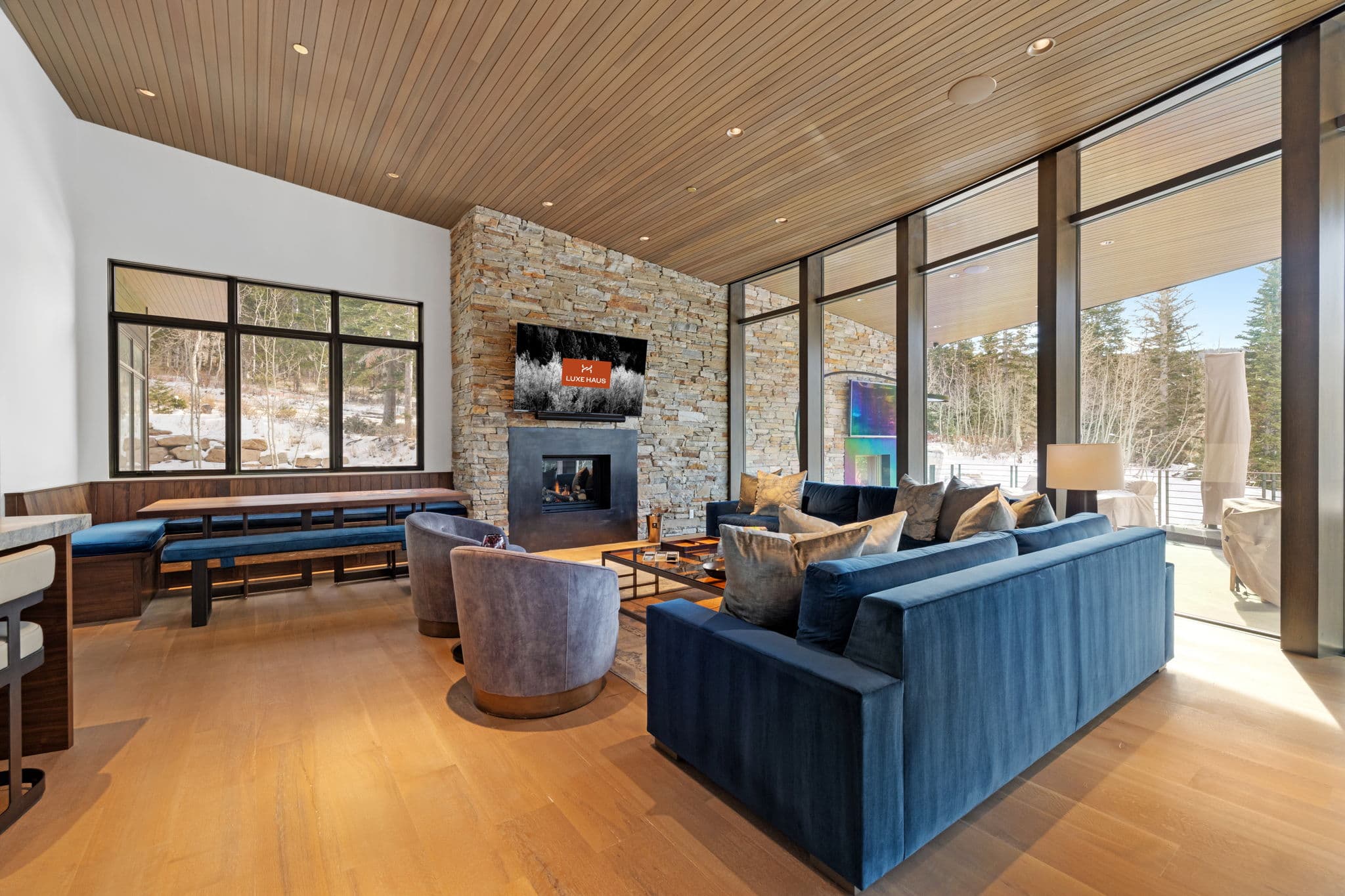 A living area with sofas, a coffee table, and a fireplace.