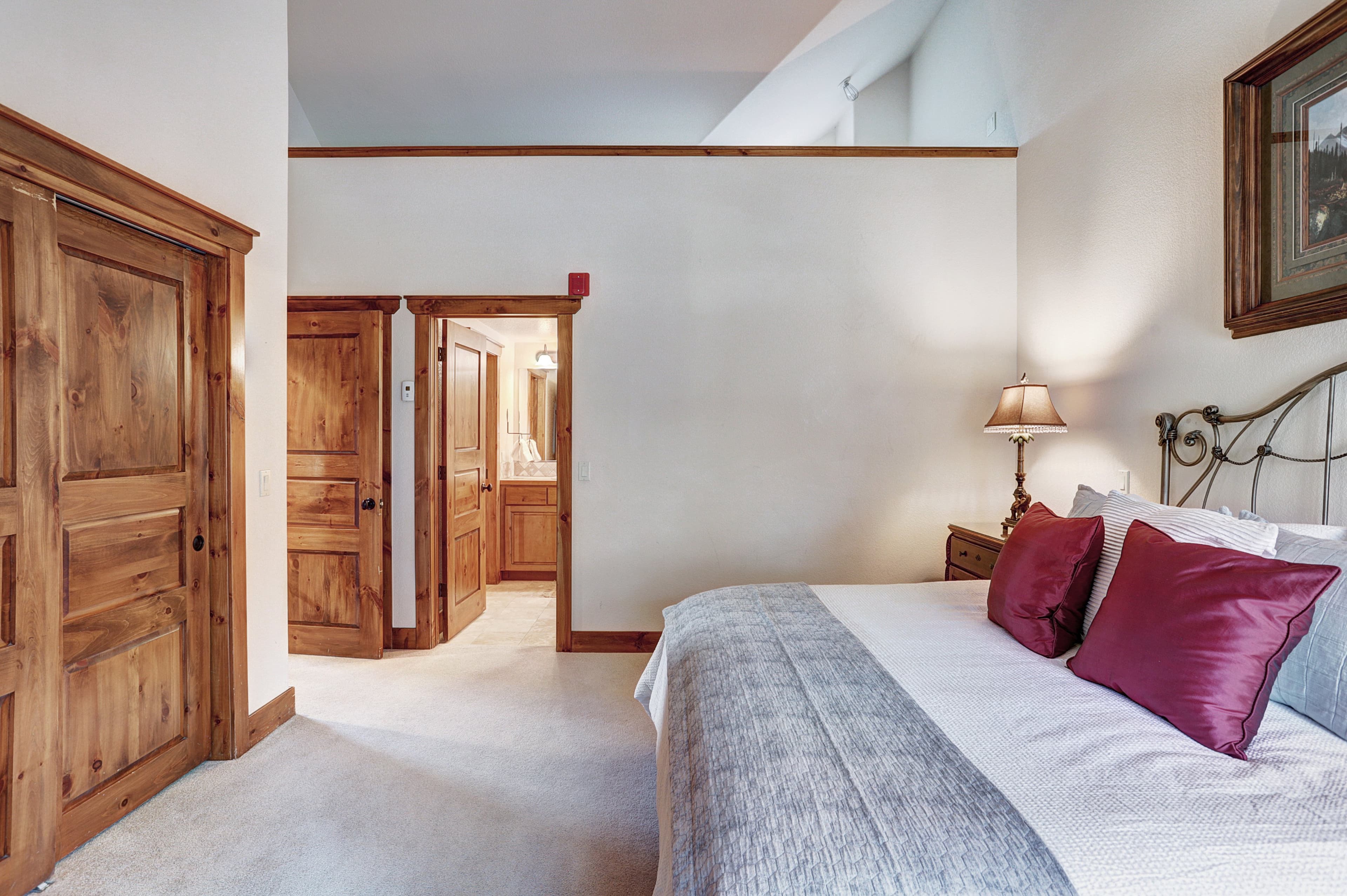 This primary bedroom offers ample closet space and a private ensuite bathroom - Amber Sky Breckenridge Vacation Rental