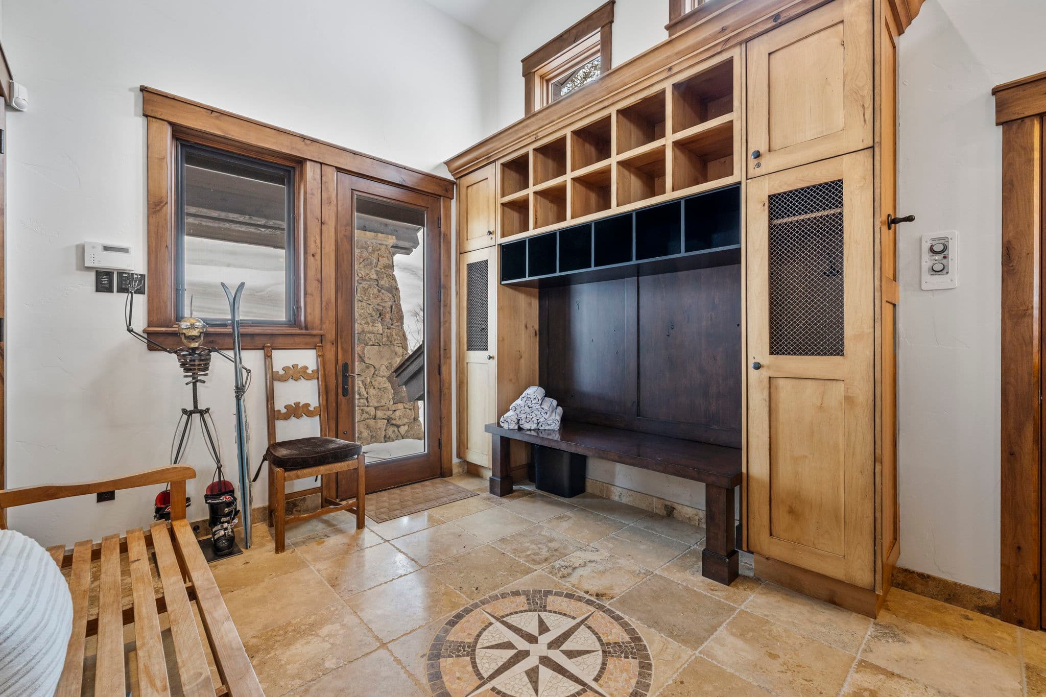 the ski room with hot coco station and ski storage