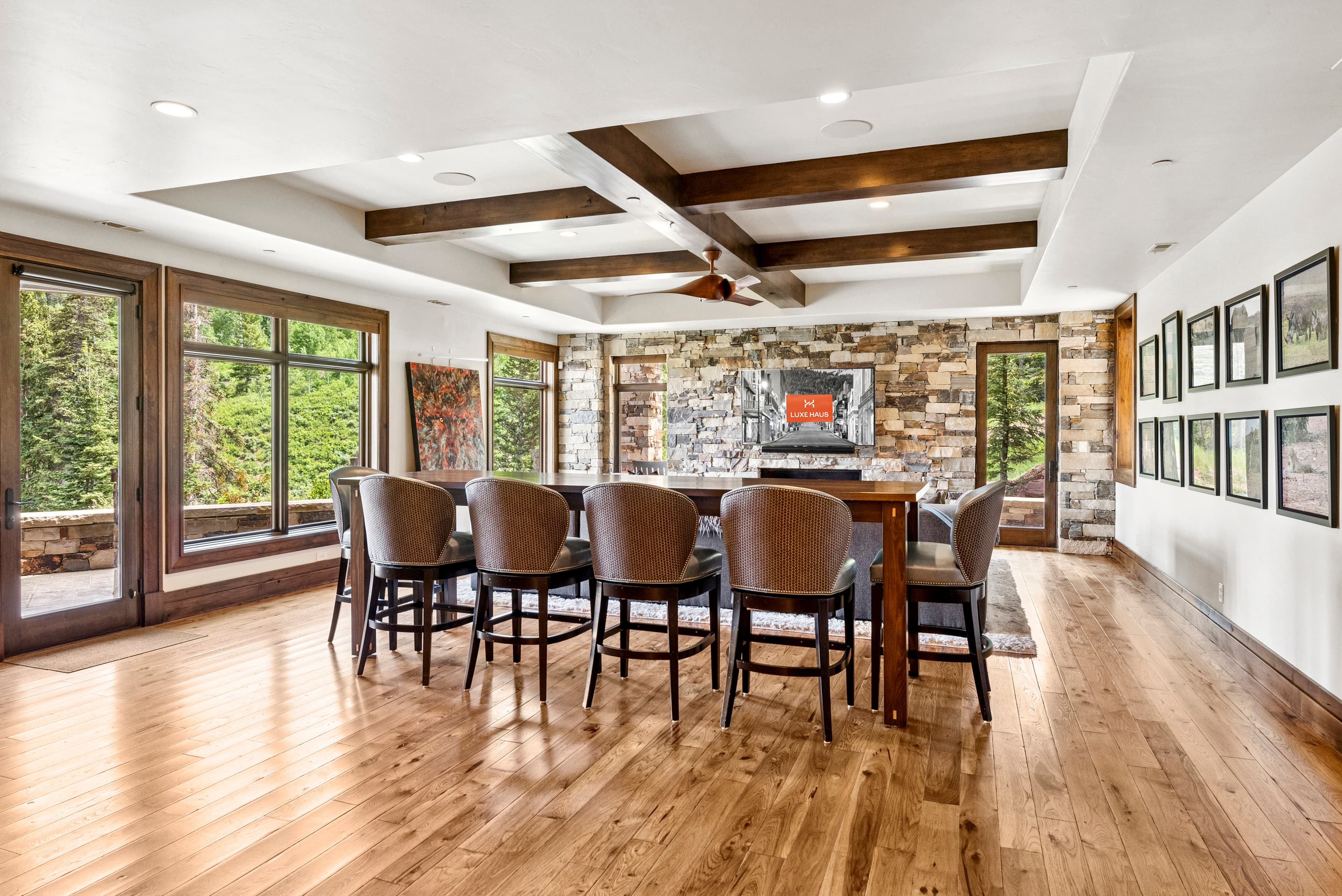 bar seating and and large sectional couches in lower living room