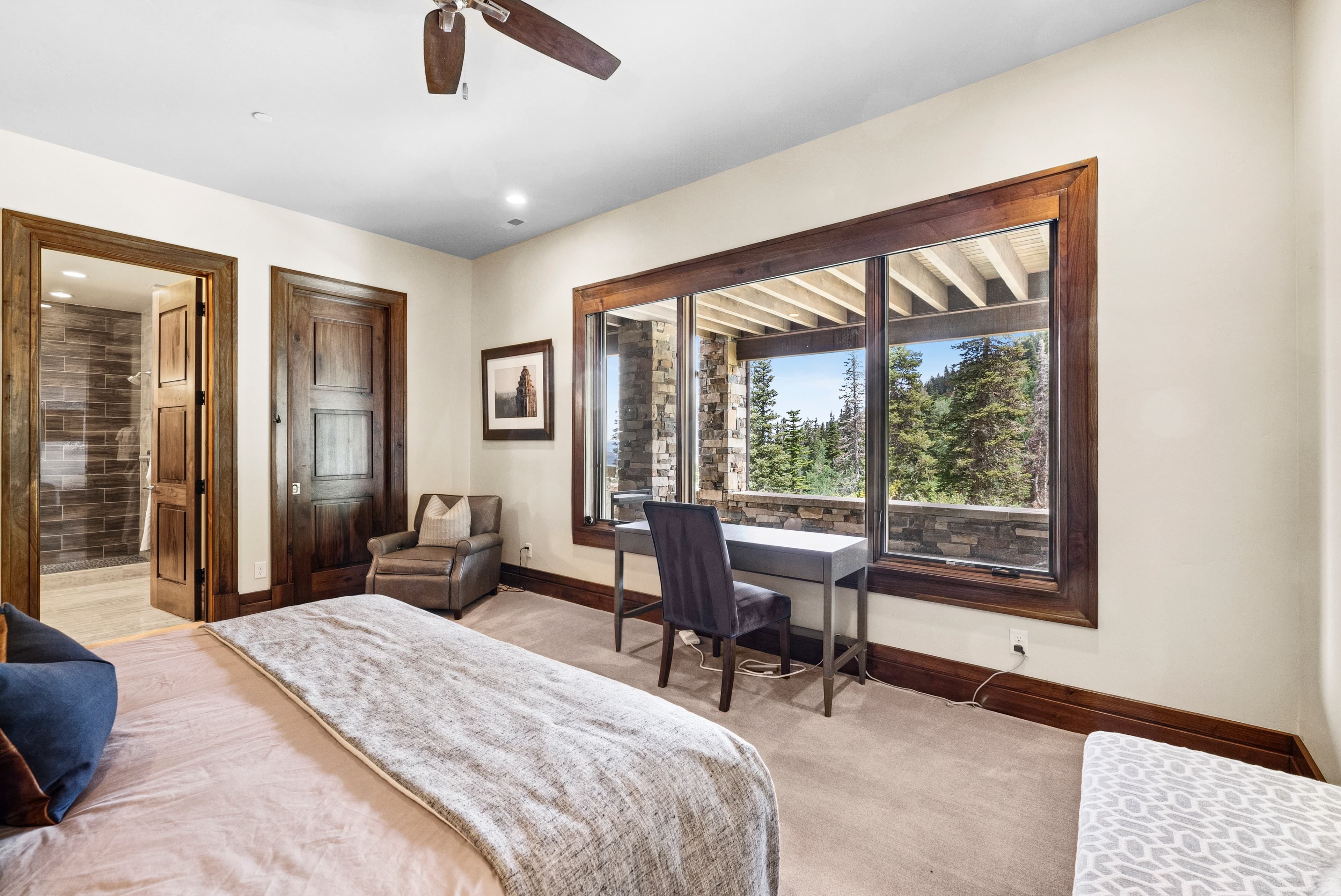 stunning views through a wide tall window in the guest suite